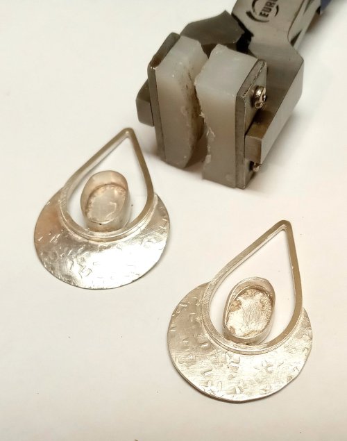 Judy Larson's Disc Cutter Earrings Remodel - , Metalwork, Cutting, Cutting Tool, Cutters, Filing, Finishing, Butane Torch, Soldering, Solder, using a nylon bracelet bending pliers to softly curve the disc portion